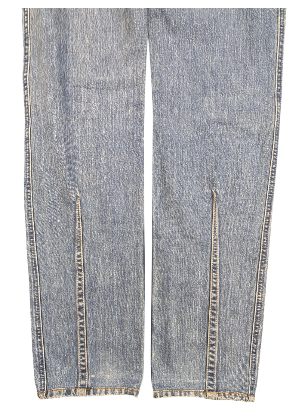 JAKE & IPI light wash denim jeans with front leg slits and frayed hems.