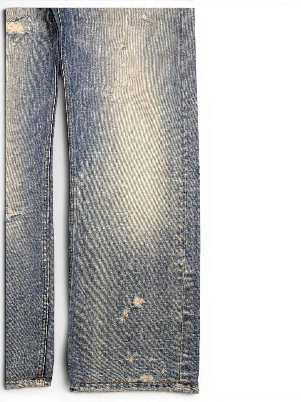 JAKE & IPI light wash distressed denim jeans with ripped details and frayed hem. Straight leg fit.