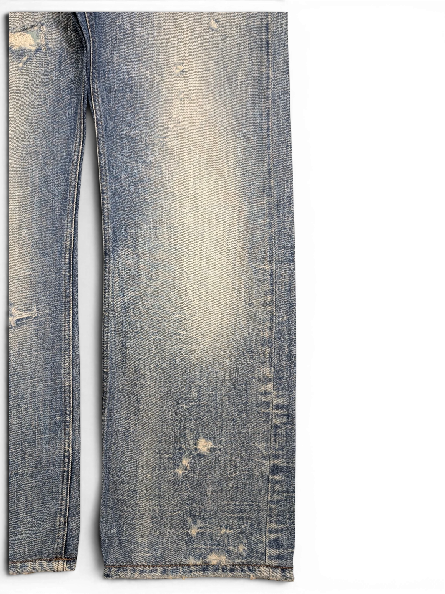 JAKE & IPI light wash distressed denim jeans with ripped details and frayed hem. Straight leg fit.