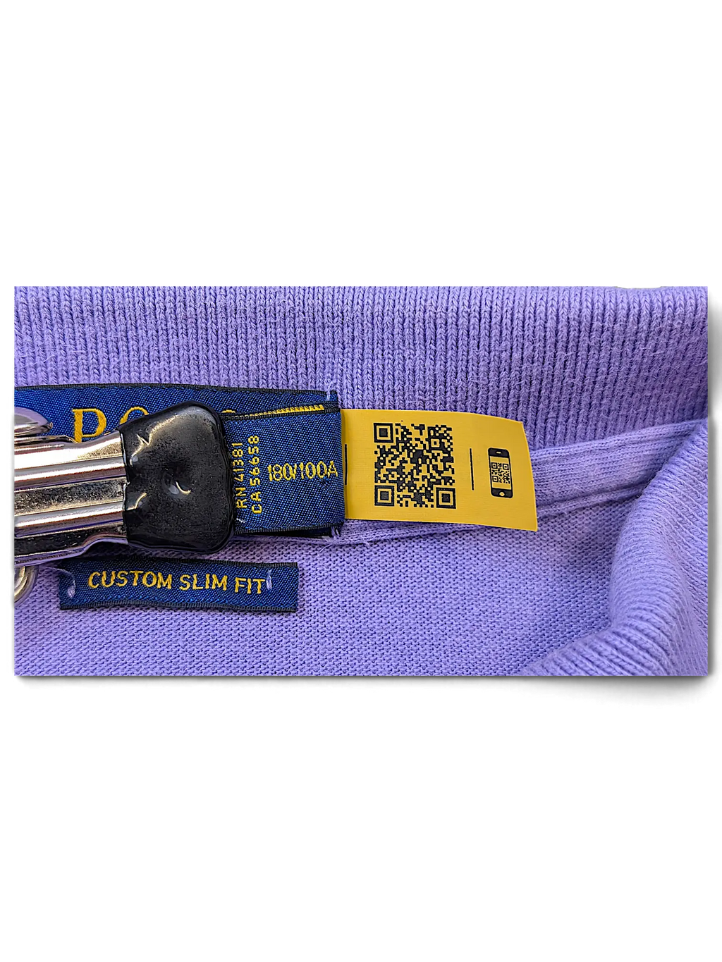 JAKE & IPI lilac polo shirt featuring a custom slim fit label and a yellow QR code authentication tag