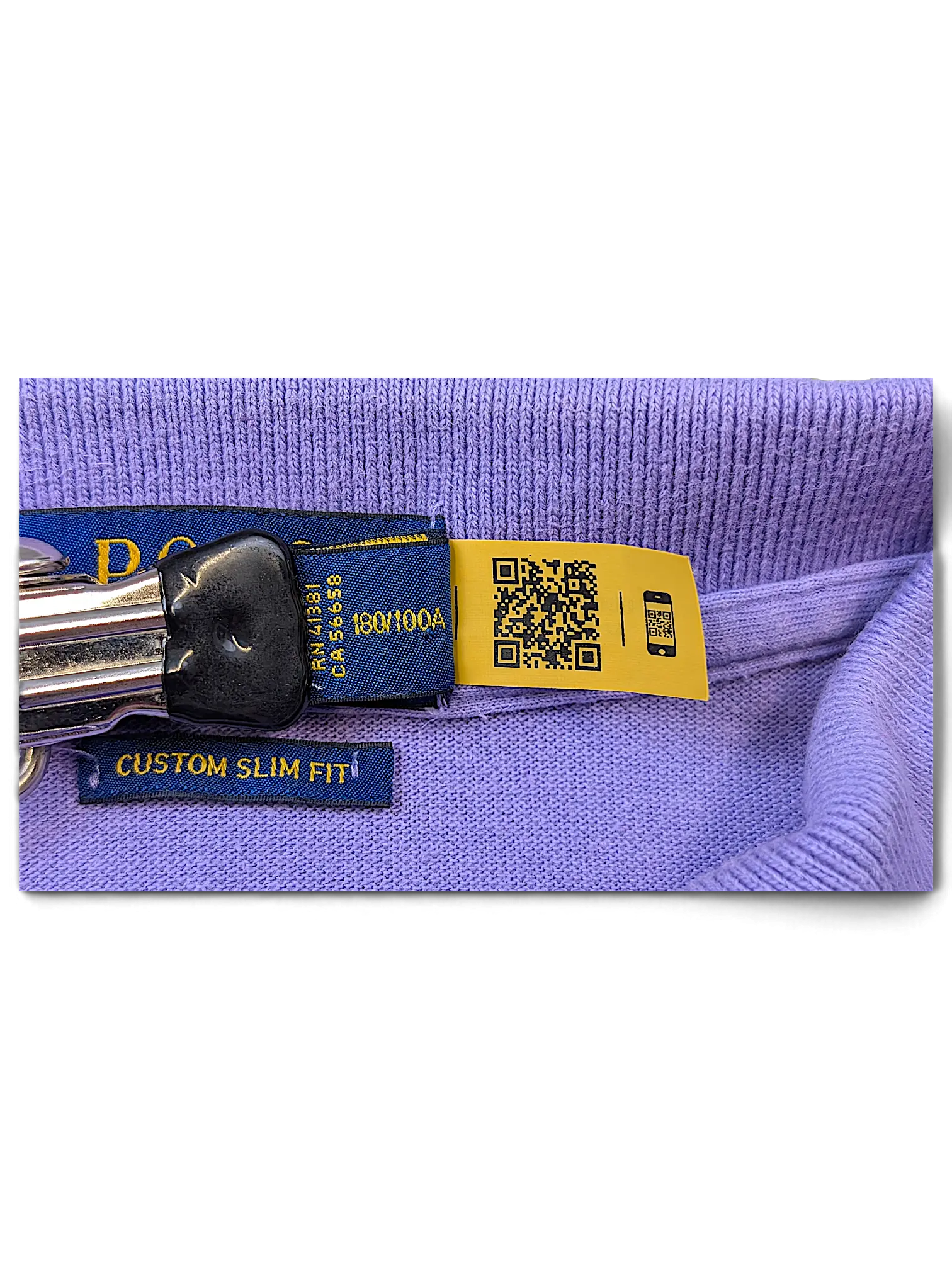 JAKE & IPI lilac polo shirt featuring a custom slim fit label and a yellow QR code authentication tag