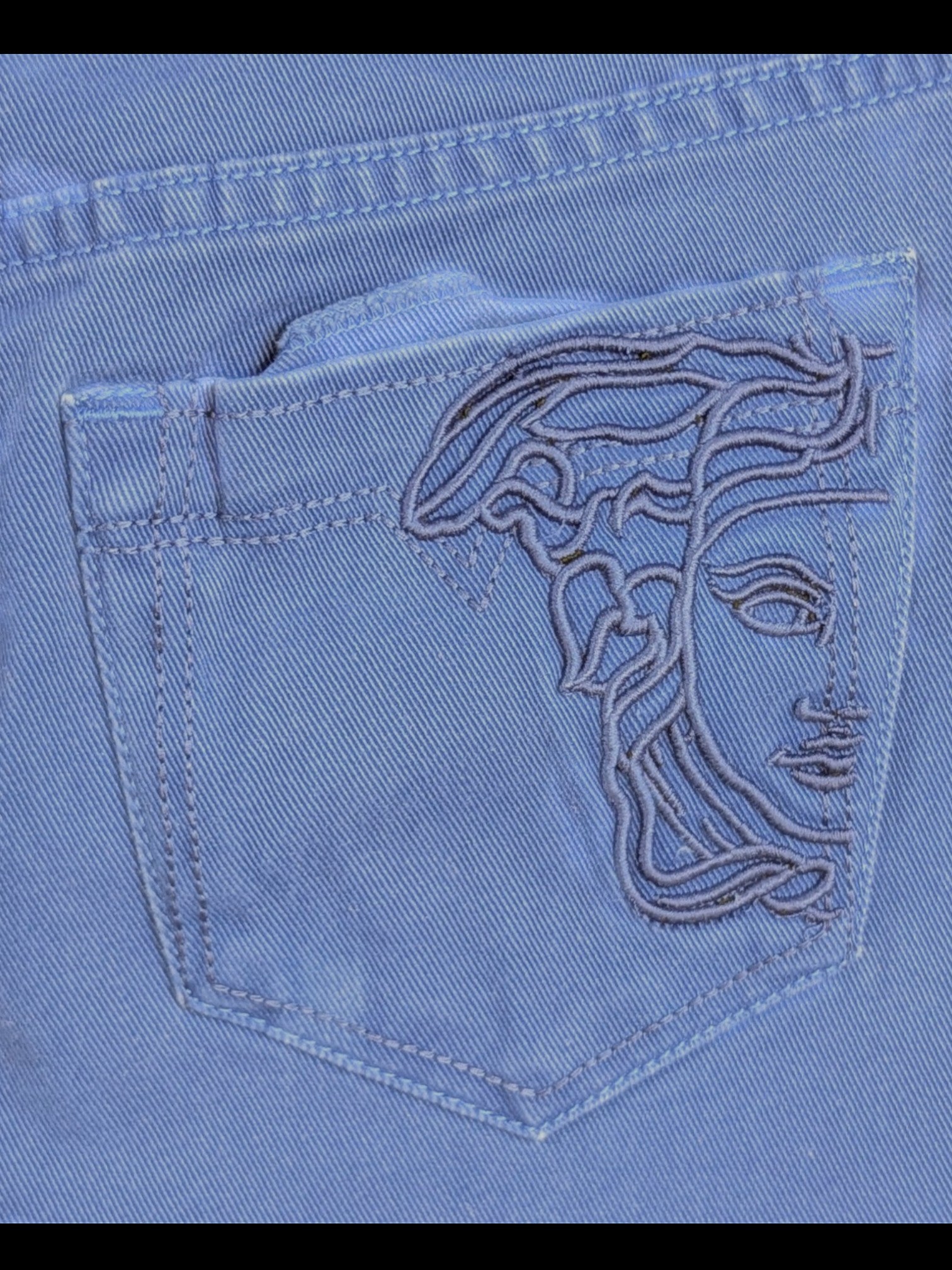 JAKE & IPI deep royal blue stretch cotton mini skirt with embroidered Medusa detail on back pocket and gold hardware.