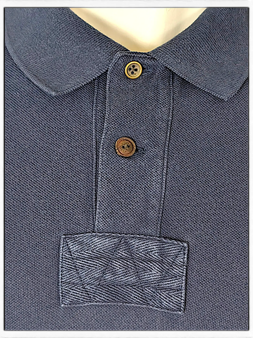 JAKE & IPI navy blue polo shirt with textured collar, button placket, and herringbone detail on the chest.