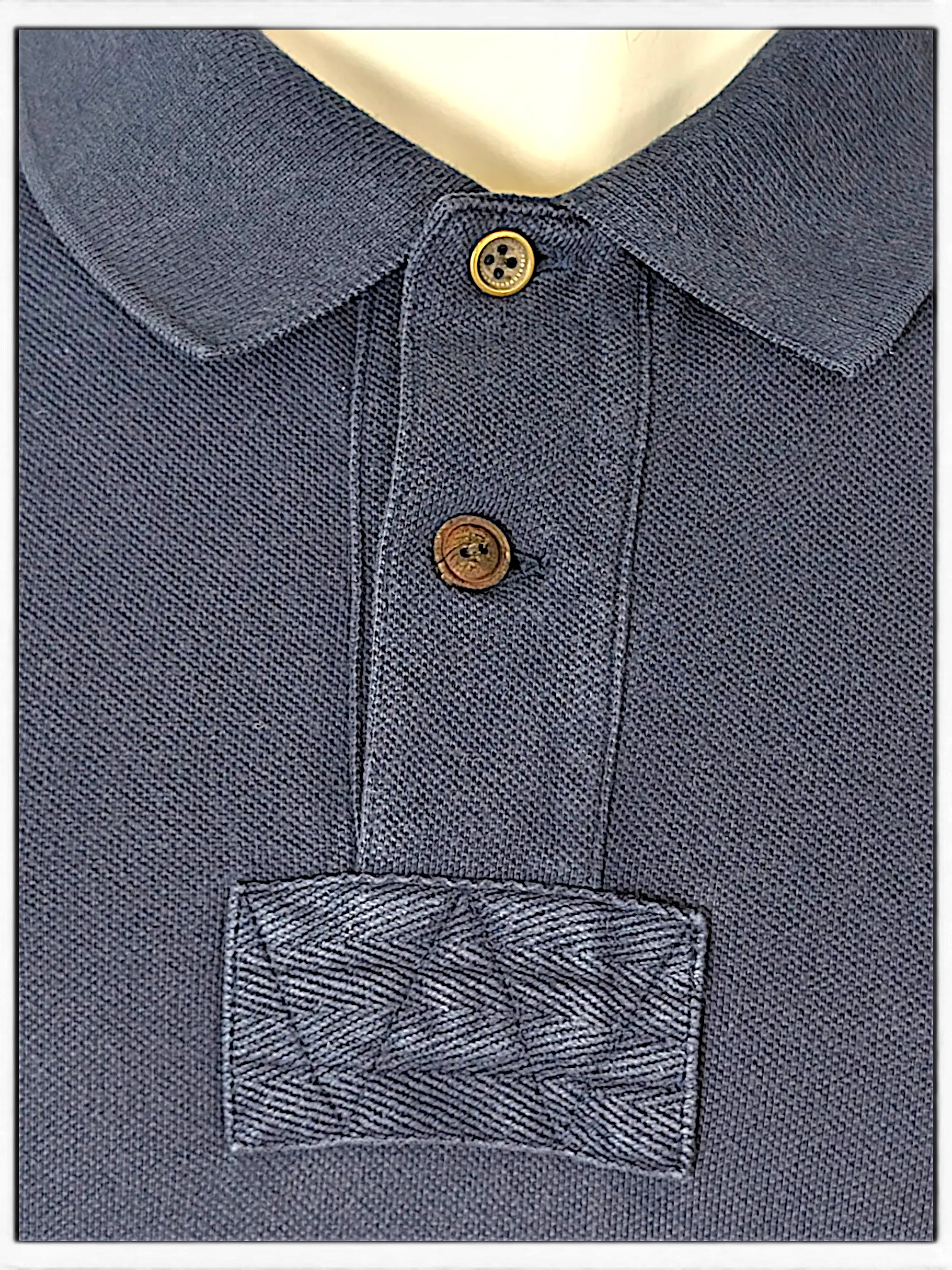 JAKE & IPI navy blue polo shirt with textured collar, button placket, and herringbone detail on the chest.