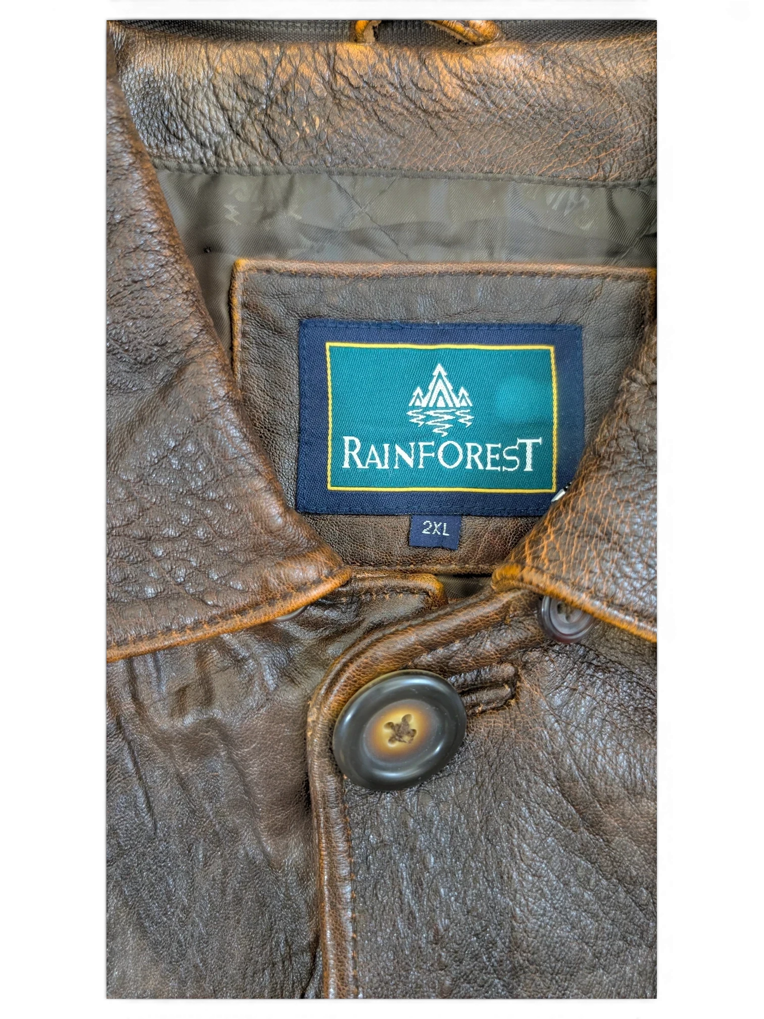 JAKE & IPI Rainforest brown distressed leather jacket with button closure and quilted lining.