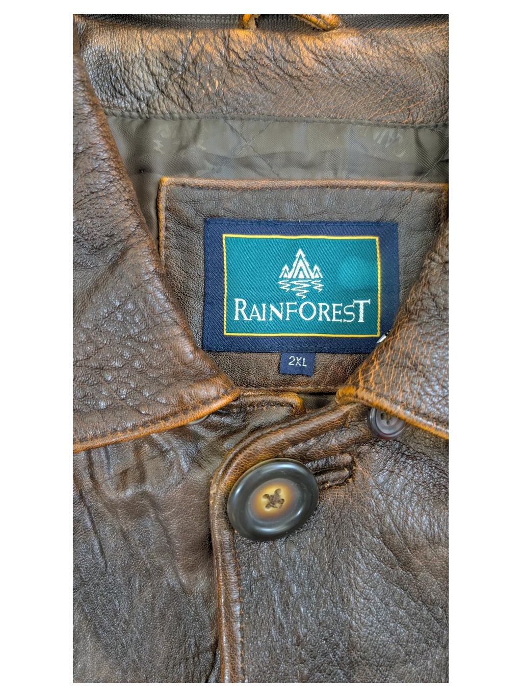 JAKE & IPI Rainforest brown distressed leather jacket with button closure and quilted lining.