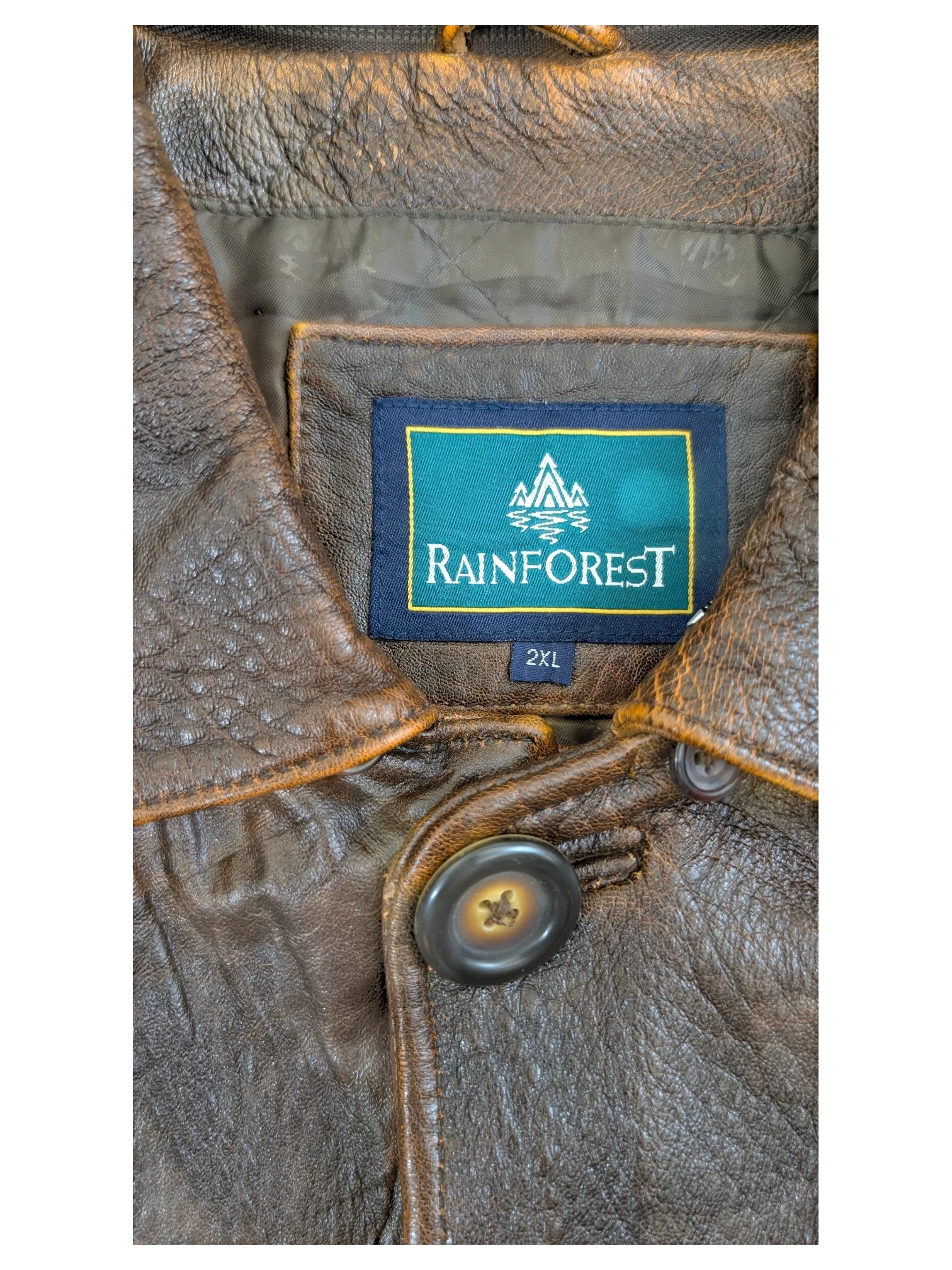 JAKE & IPI Rainforest brown distressed leather jacket with button closure and quilted lining.