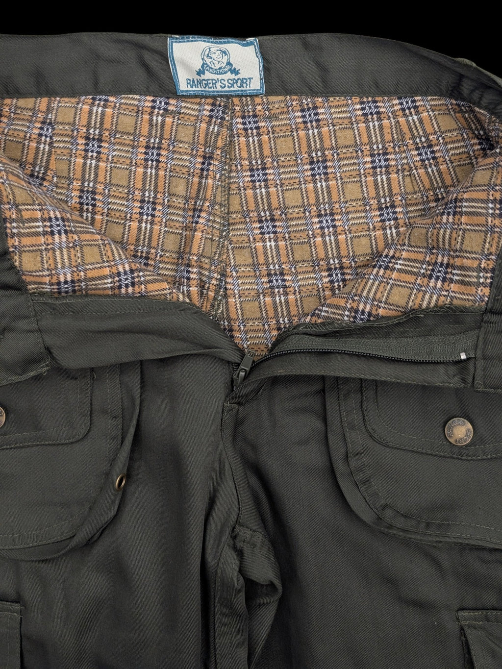 JAKE & IPI Ranger's Sport cargo pants in dark green with plaid lining and multiple pockets.
