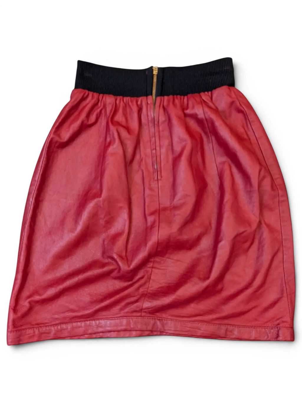 JAKE & IPI red faux leather mini skirt with a black ribbed elastic waistband and front gold zipper detail.