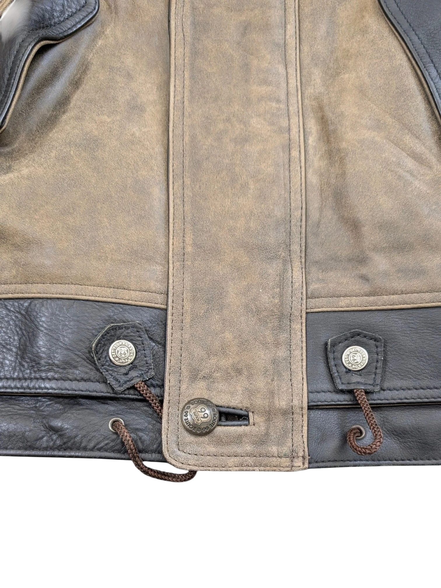 JAKE & IPI Route 66 leather jacket with brown suede and black leather panels, featuring drawstring waist and branded buttons.