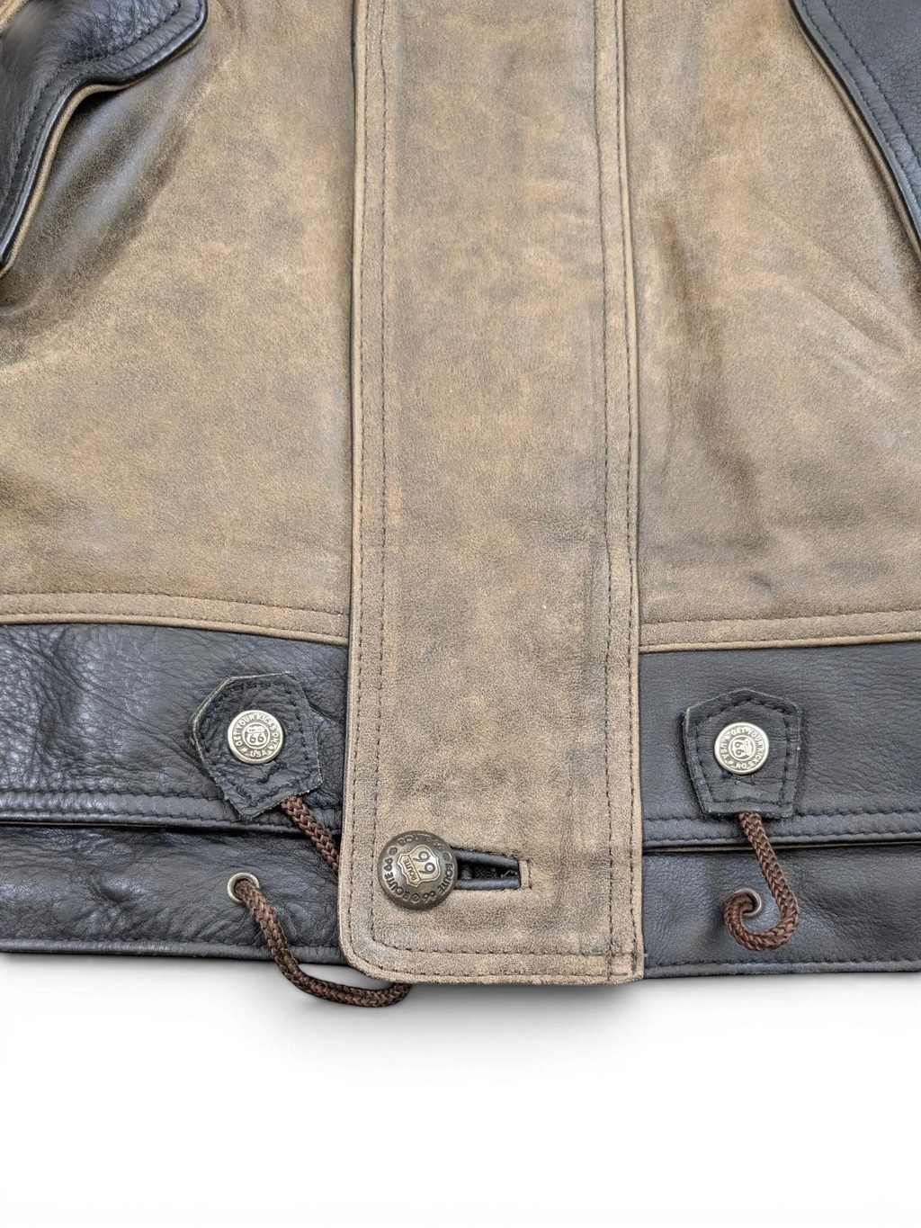 JAKE & IPI Route 66 leather jacket with brown suede and black leather panels, featuring drawstring waist and branded buttons.