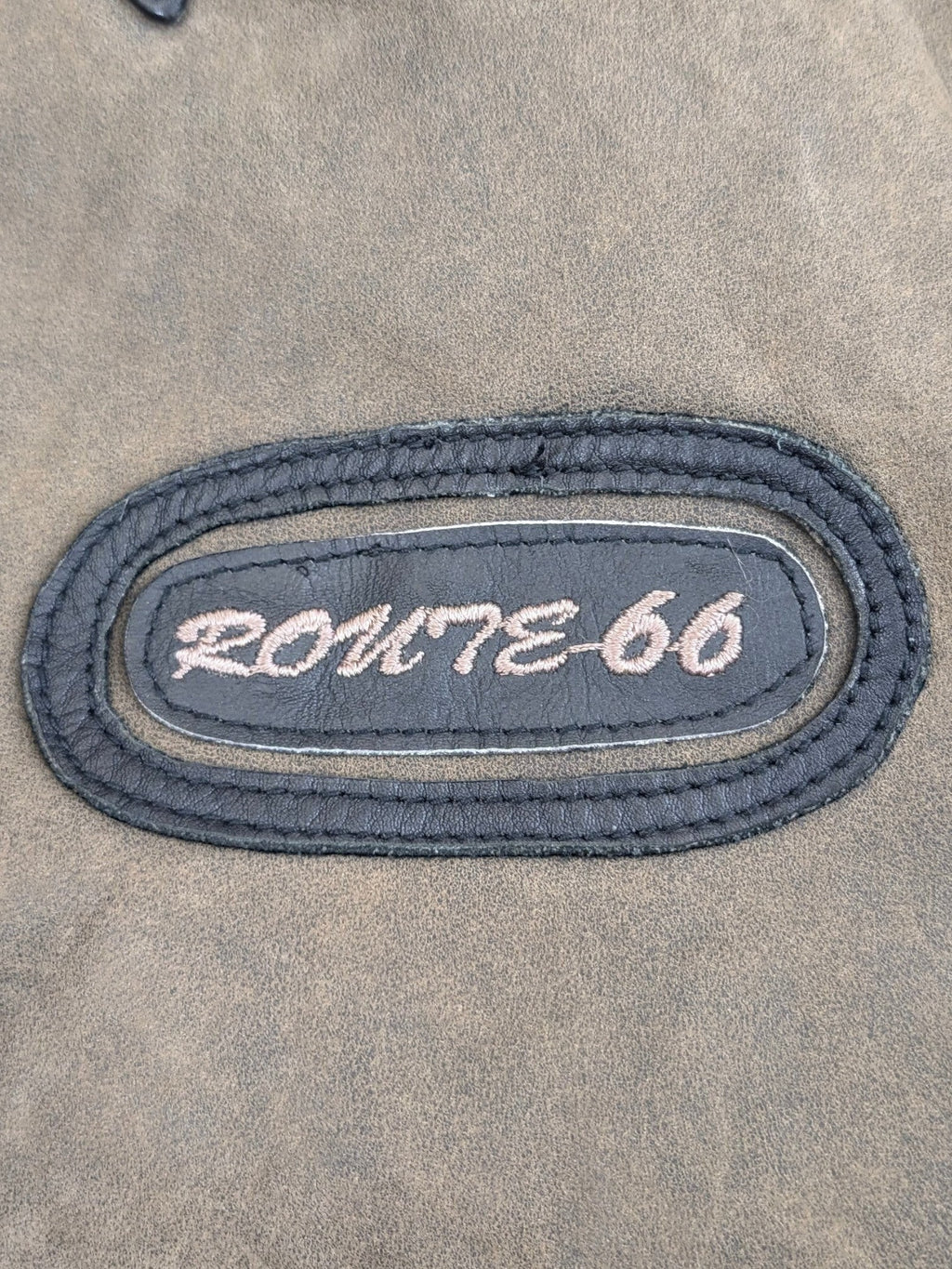 JAKE & IPI Route 66 leather jacket in distressed brown with embroidered oval patch.
