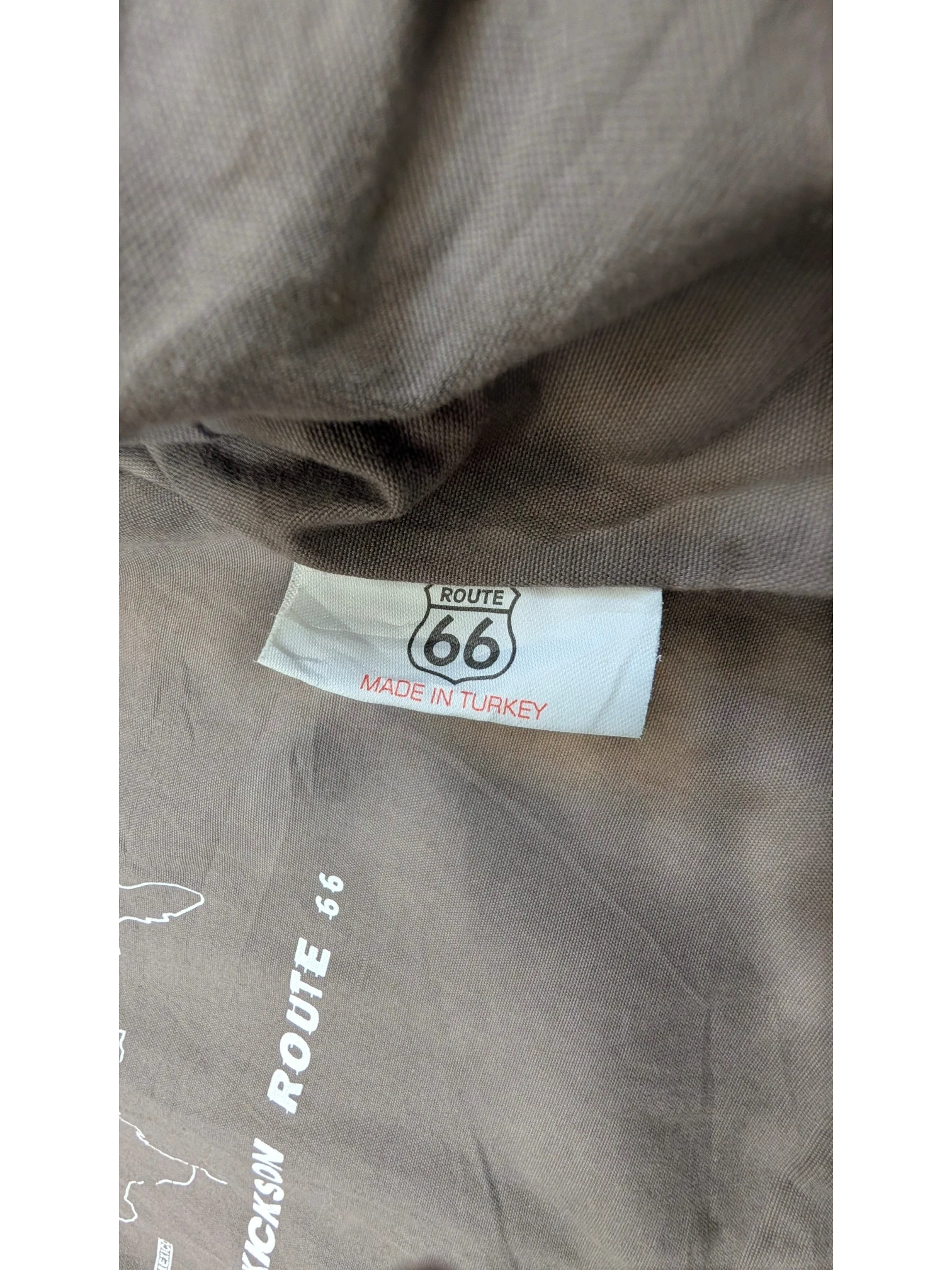 JAKE & IPI Route 66 leather jacket with "Made in Turkey" label and map graphic.
