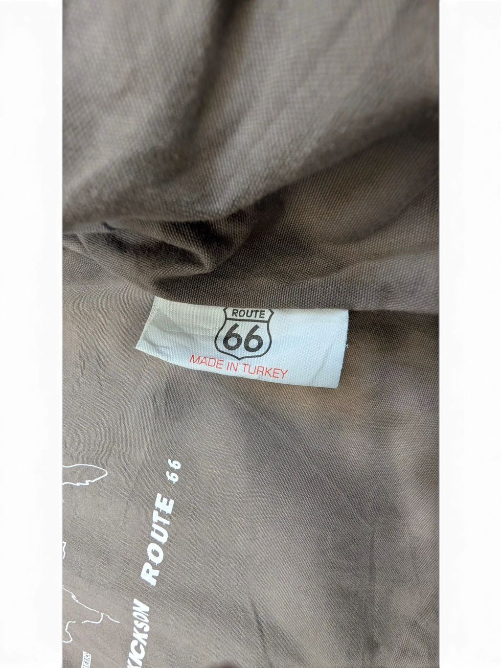 JAKE & IPI Route 66 leather jacket with "Made in Turkey" label and map graphic.