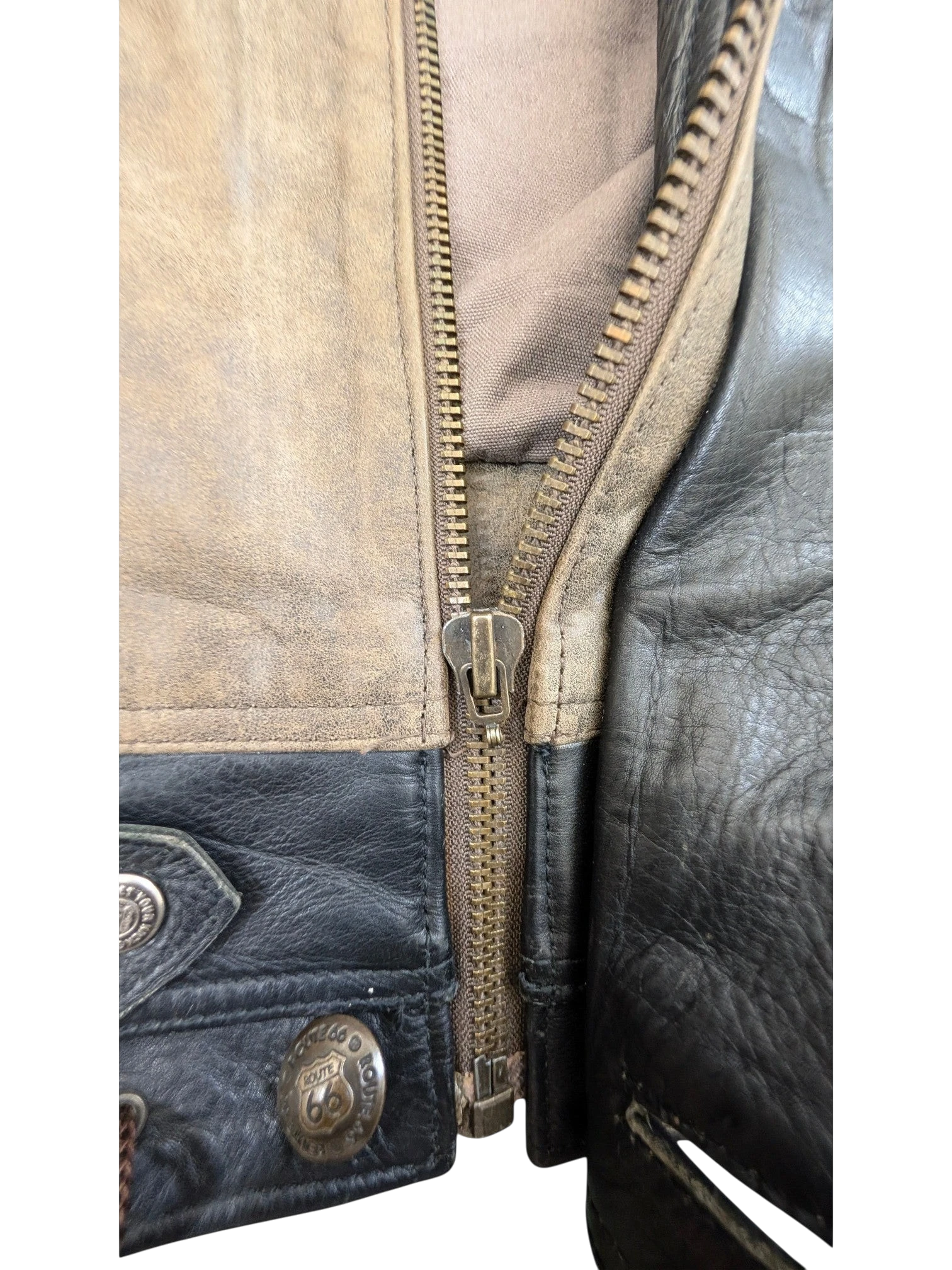 JAKE & IPI Route 66 leather jacket with a distressed tan and black finish, featuring a zip closure and metal snaps.