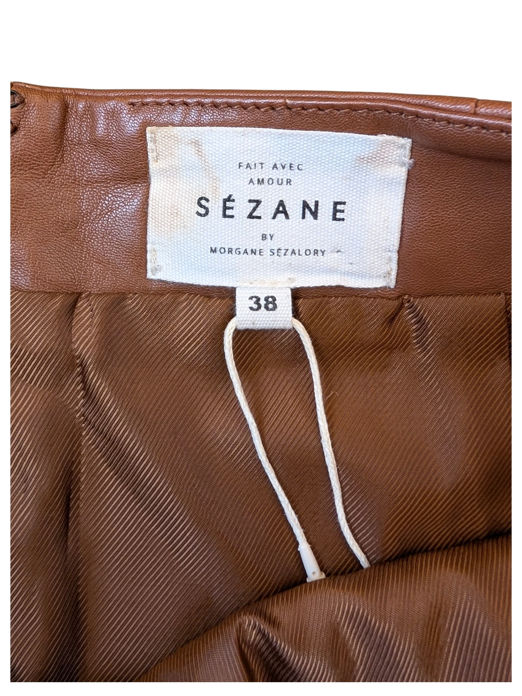 JAKE & IPI brown leather Sézane skirt with size 38 tag and interior lining detail.