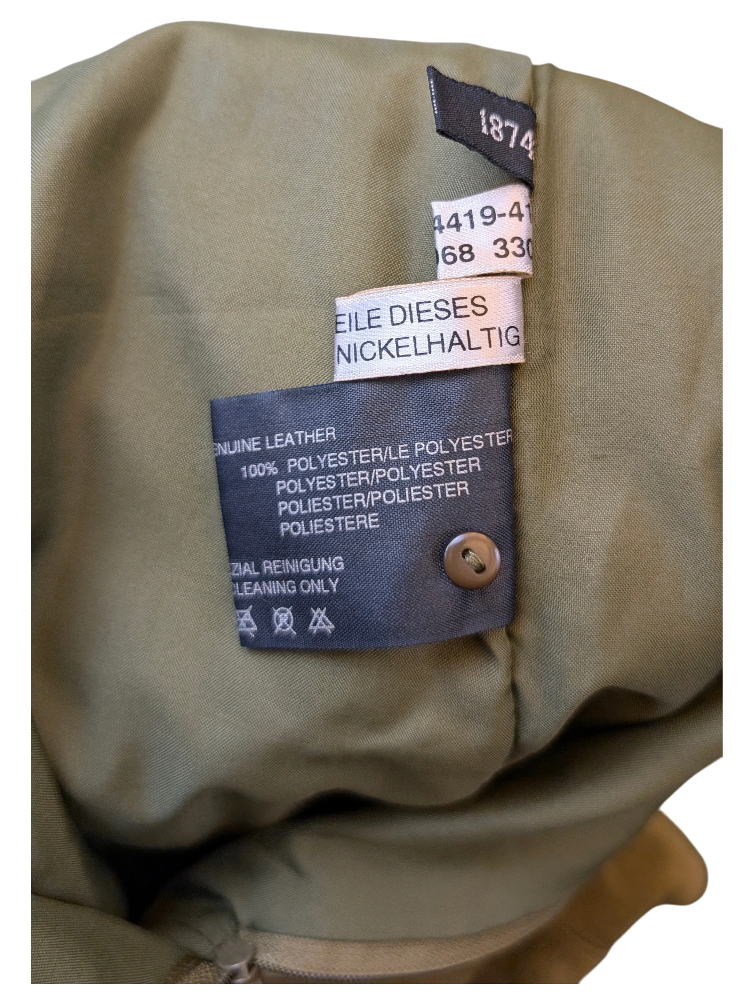 JAKE & IPI Apart Fashion suede skirt interior label showing genuine leather and polyester lining details.