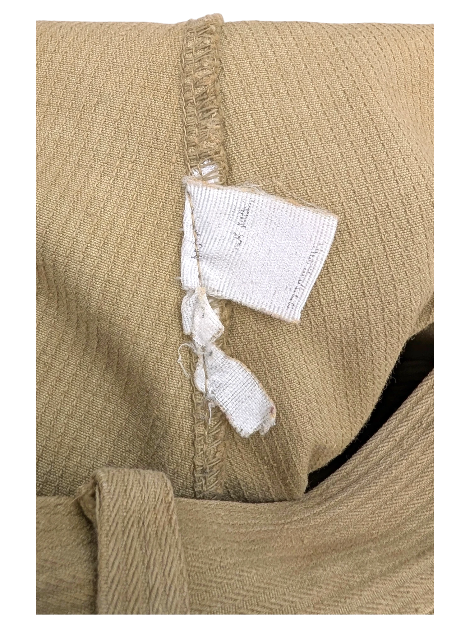 JAKE & IPI tan corduroy cargo pants with visible stitching and a torn care tag.