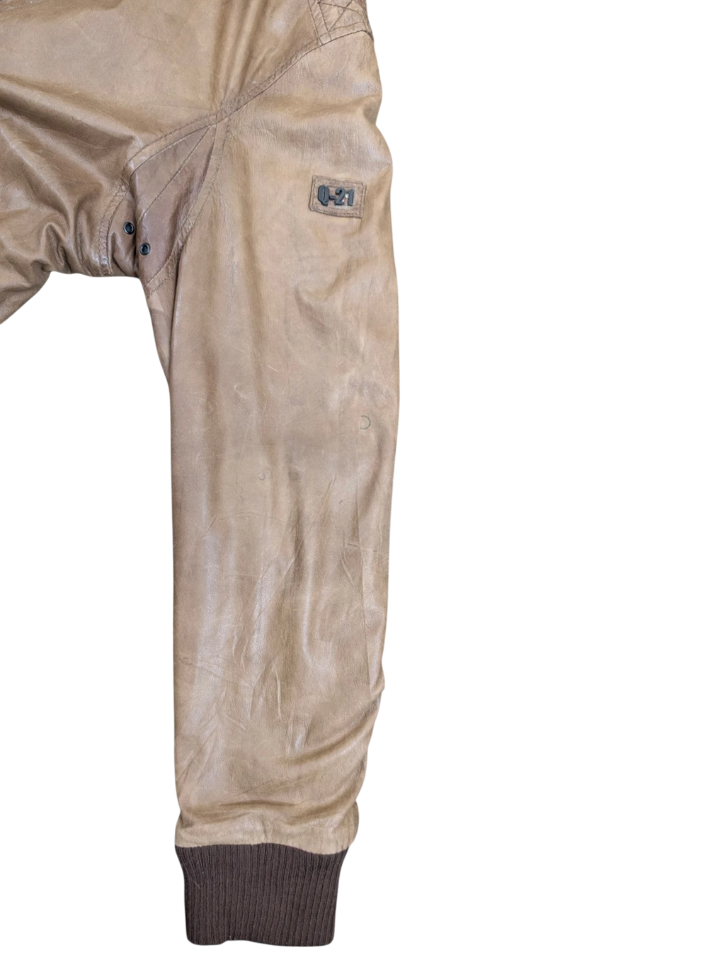 JAKE & IPI tan distressed leather bomber jacket with ribbed cuffs and a "Q-21" logo patch.