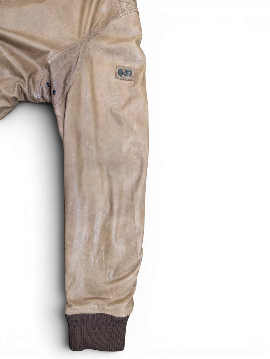 JAKE & IPI tan distressed leather bomber jacket with ribbed cuffs and a "Q-21" logo patch.