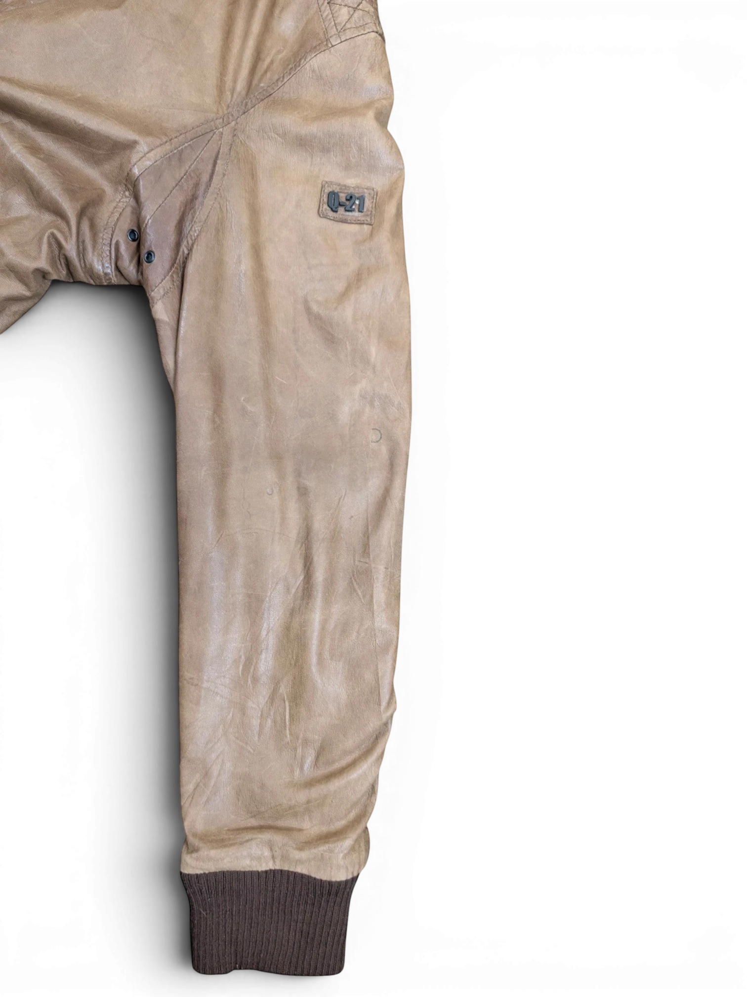 JAKE & IPI tan distressed leather bomber jacket with ribbed cuffs and a "Q-21" logo patch.