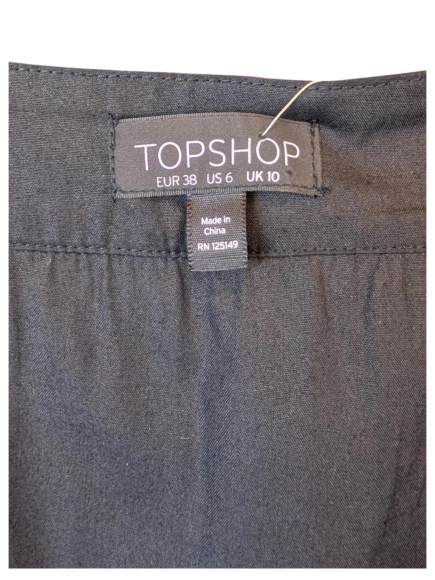 TOPSHOP black mini skirt label detail from JAKE & IPI, featuring size EUR 38, US 6, UK 10 tag.