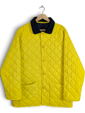 JAKE & IPI bright yellow quilted jacket with navy corduroy collar, size L. Diamond-quilted polyester with snap front and patch pockets.