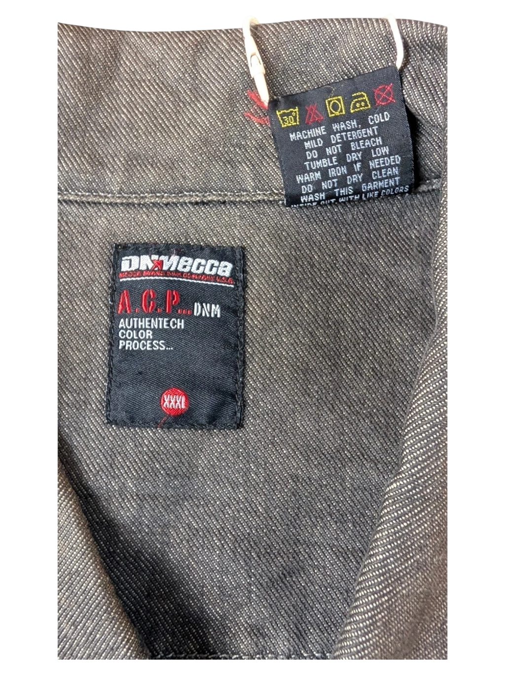 JAKE & IPI A.C.P. Denim jacket in dark grey with Authentitech color process detail.