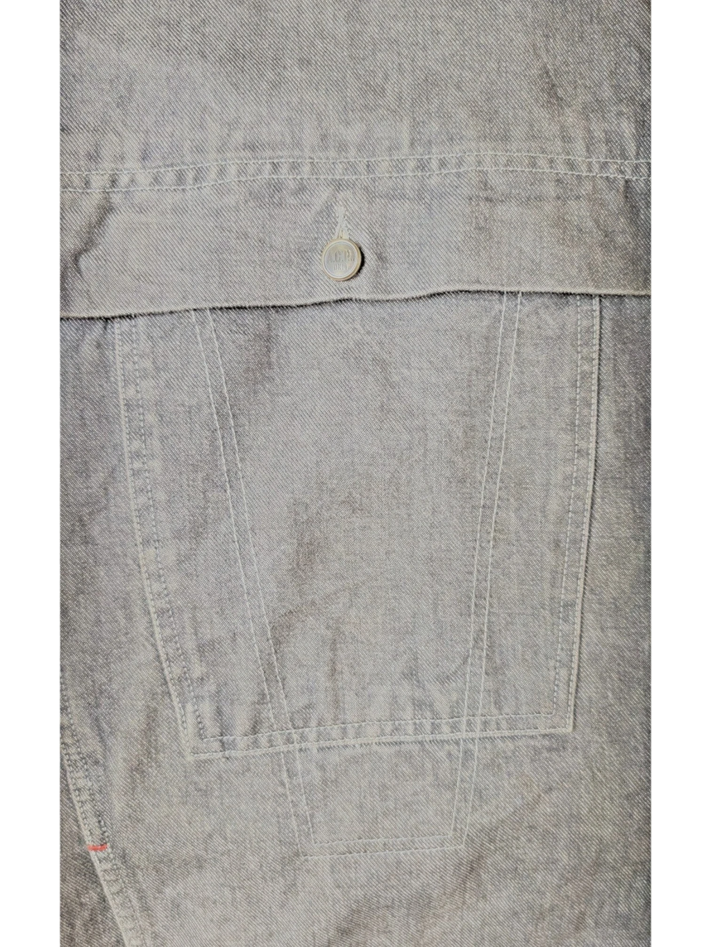 JAKE & IPI A.C.P denim jacket in grey, featuring a chest pocket with a branded button and contrast stitching.
