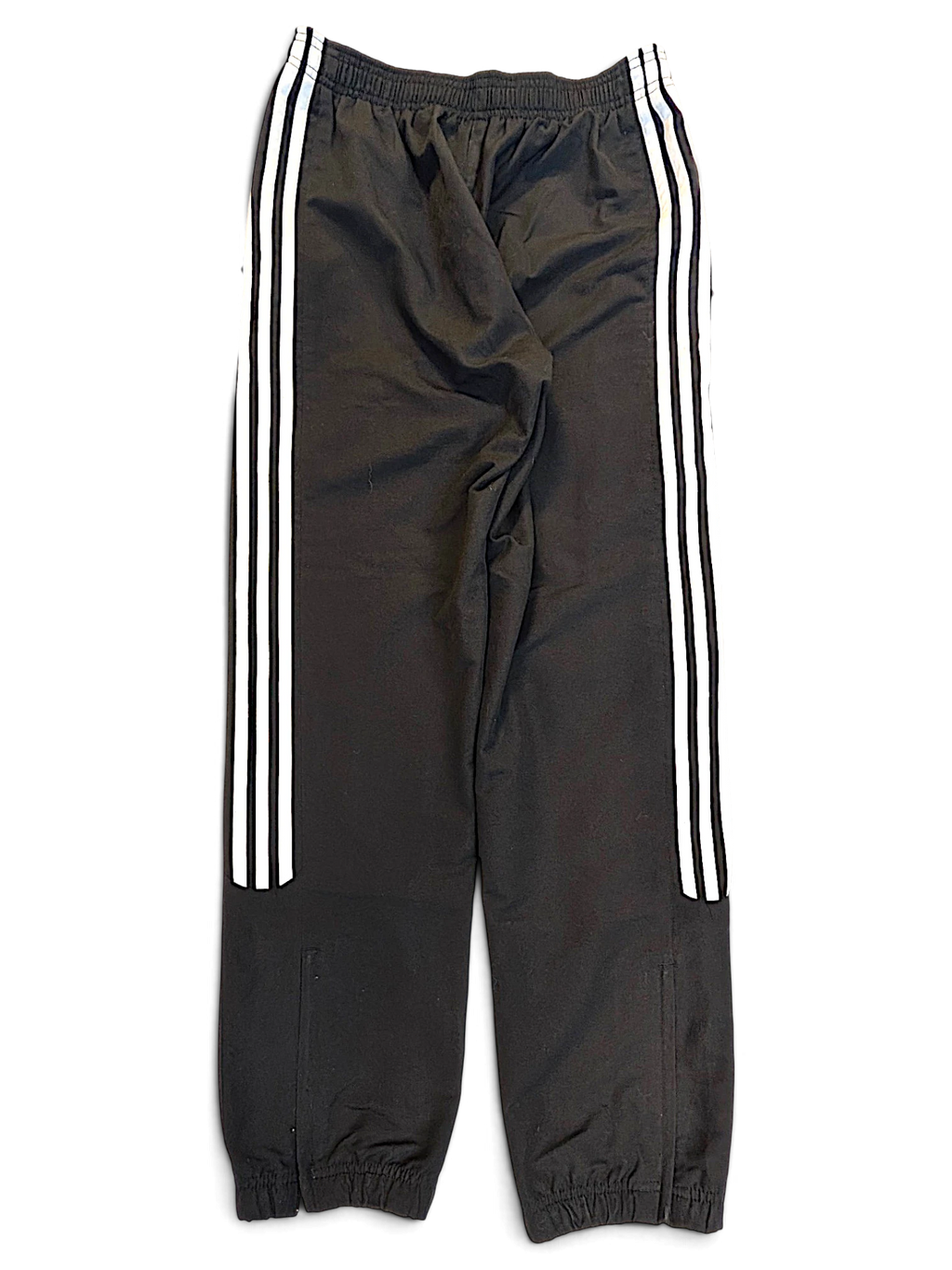 JAKE & IPI pre-owned black adidas track pants with signature white 3-stripes down the sides and tapered leg openings.