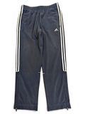 JAKE & IPI pre-owned blue adidas velour track pants with white side stripes and zippered leg openings.