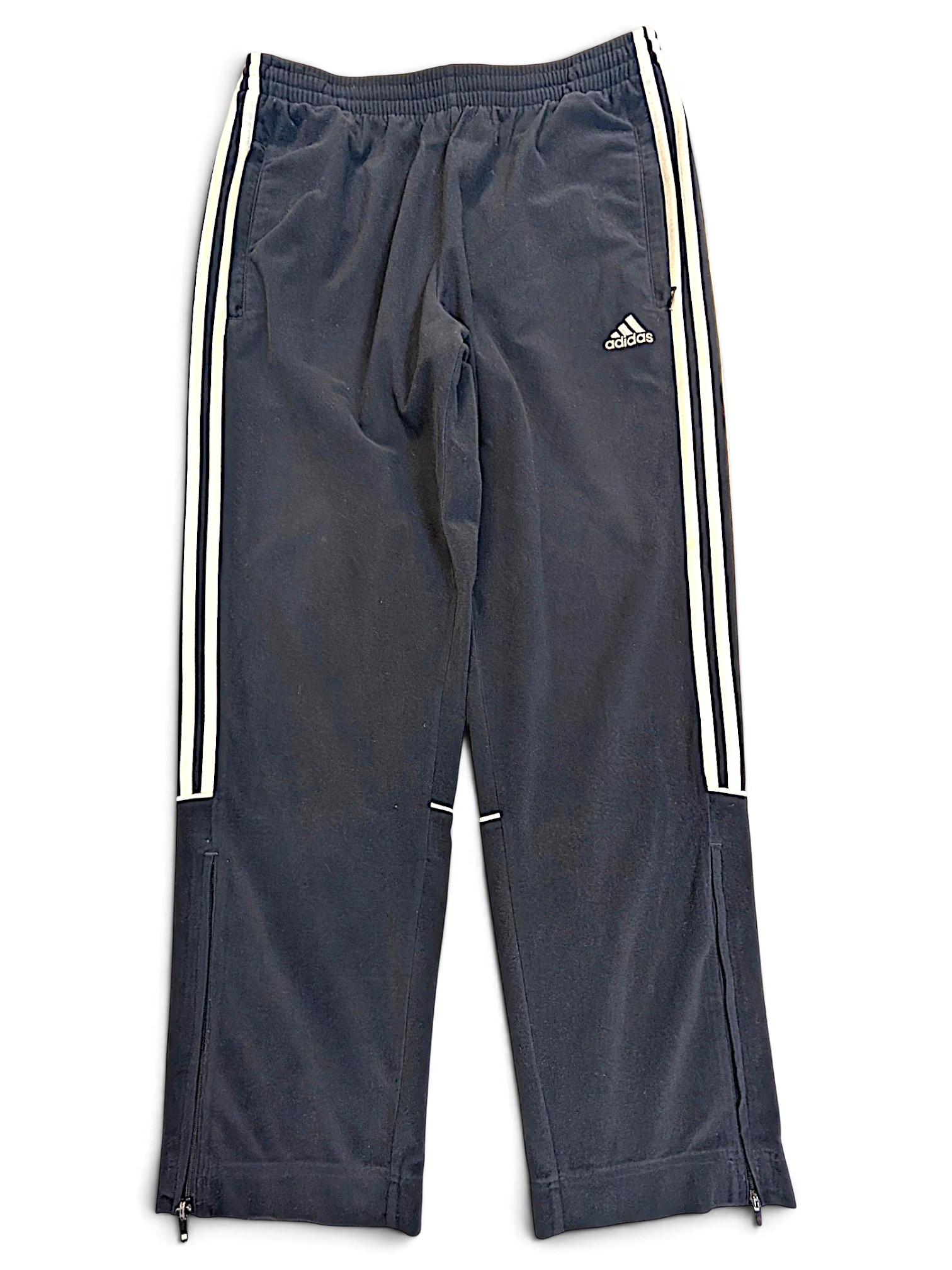 JAKE & IPI pre-owned blue adidas velour track pants with white side stripes and zippered leg openings.