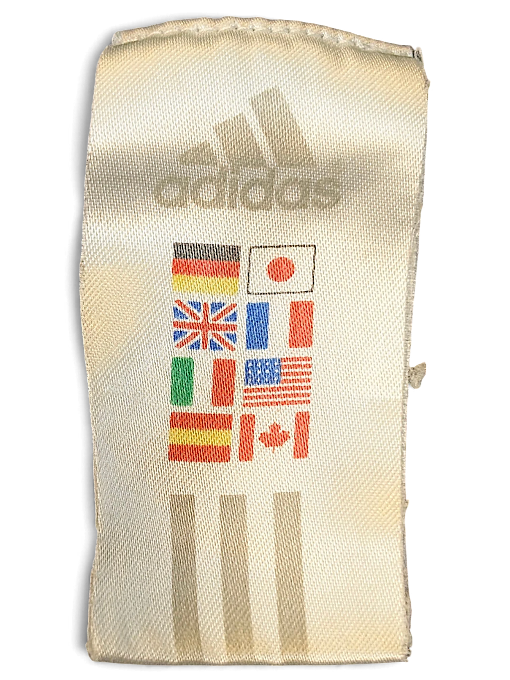JAKE & IPI adidas clothing label featuring the brand logo and international flags on a white fabric tag