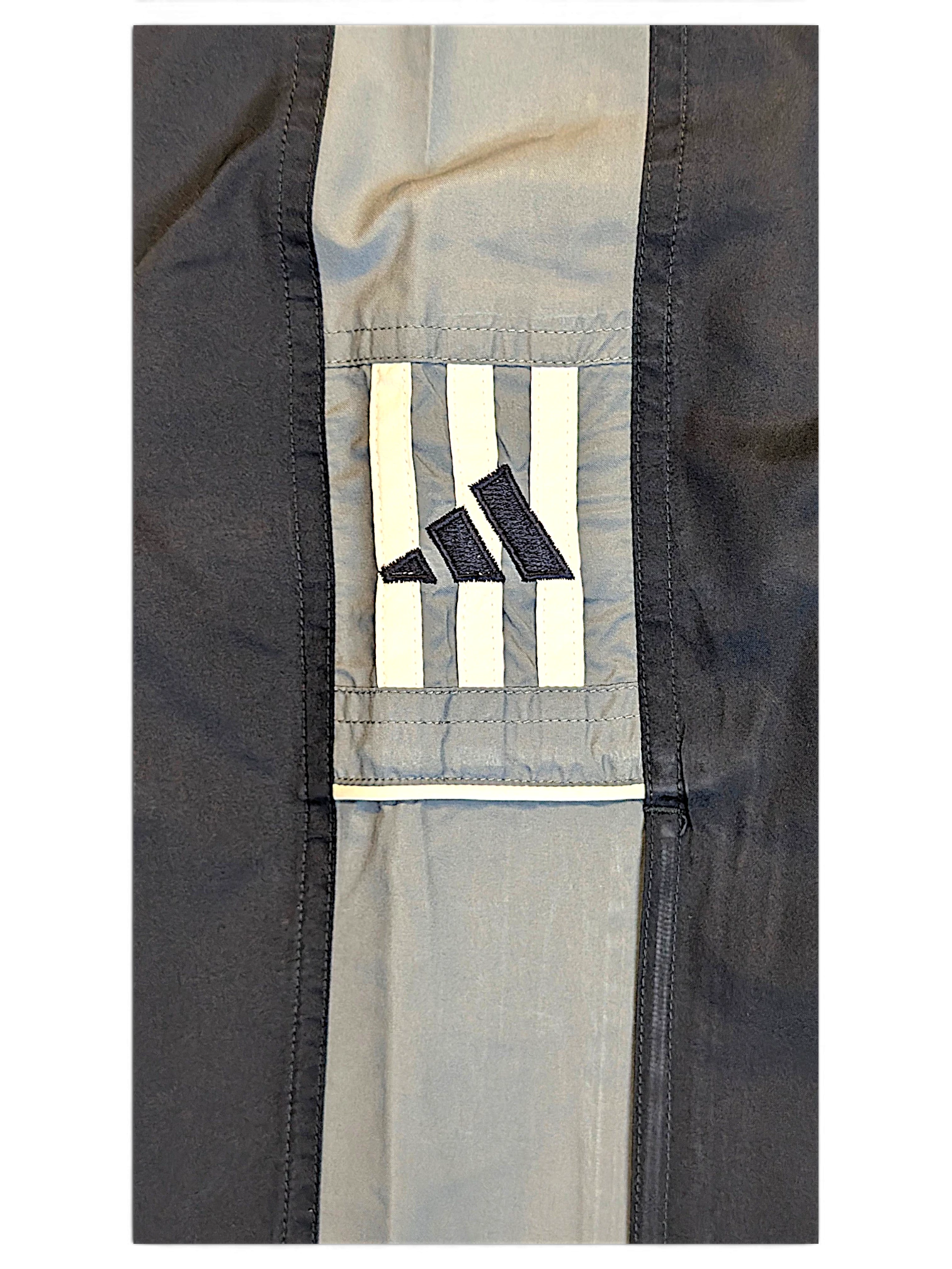 JAKE & IPI pre-owned adidas navy and grey track pants featuring embroidered logo and contrast panel detail