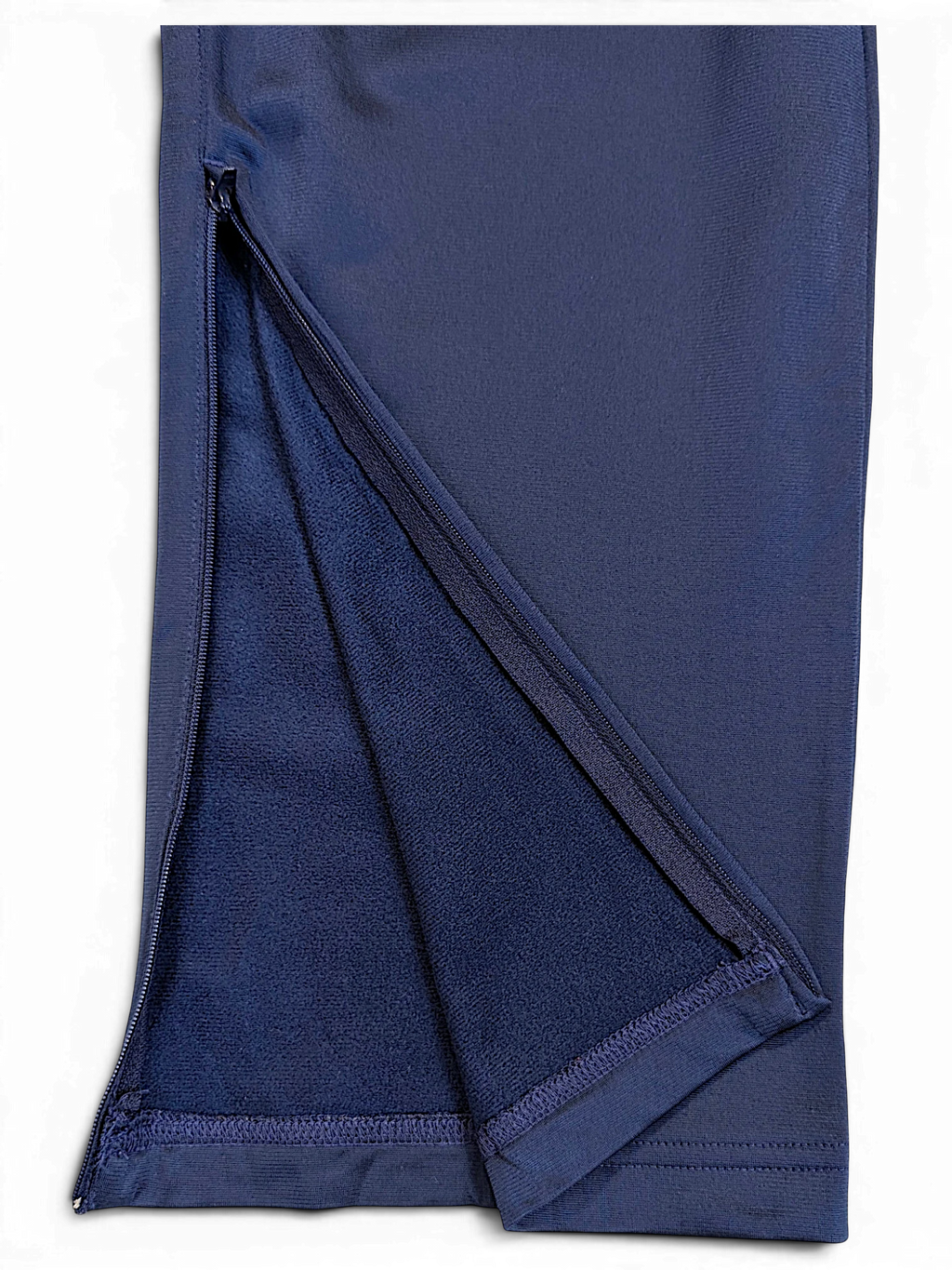 JAKE & IPI adidas navy track pants featuring a zippered leg opening and soft fleece lining detail