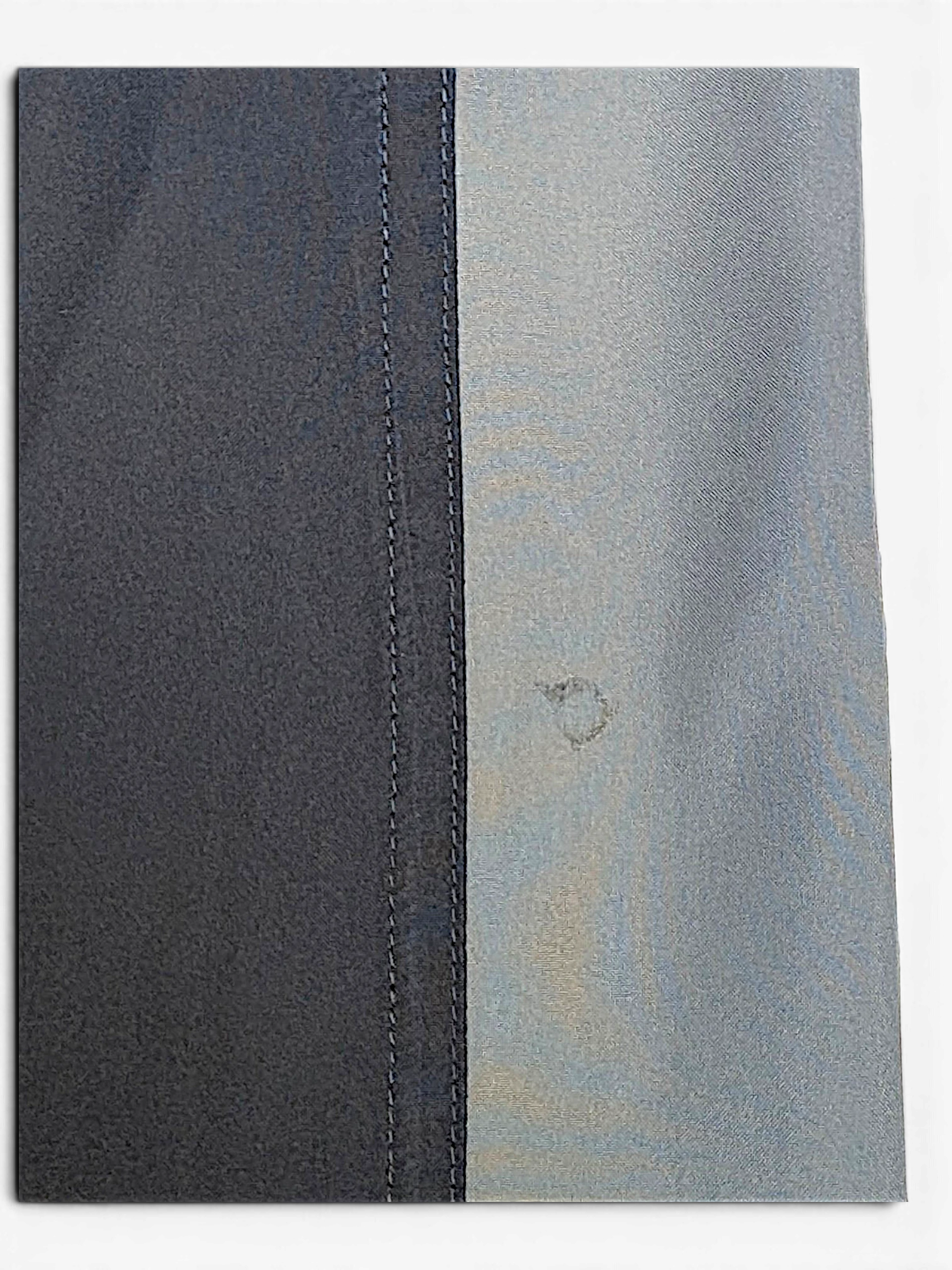 JAKE & IPI adidas navy and grey track pants fabric detail showing contrast panel stitching and a small mark