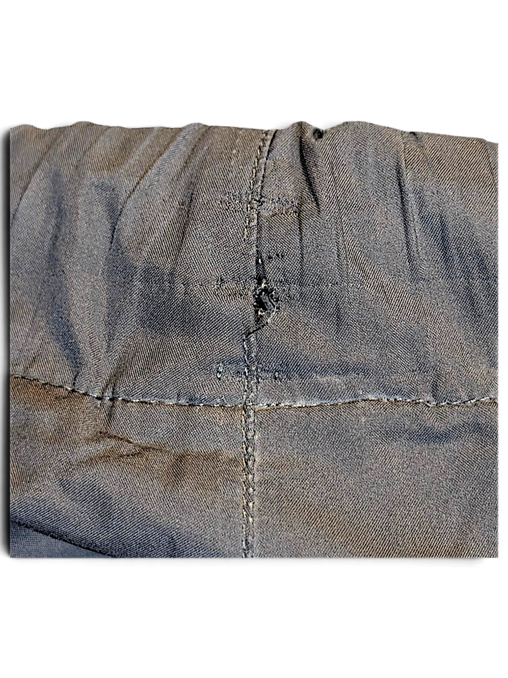 JAKE & IPI adidas navy and grey track pants showing a small fabric repair on the waistband seam