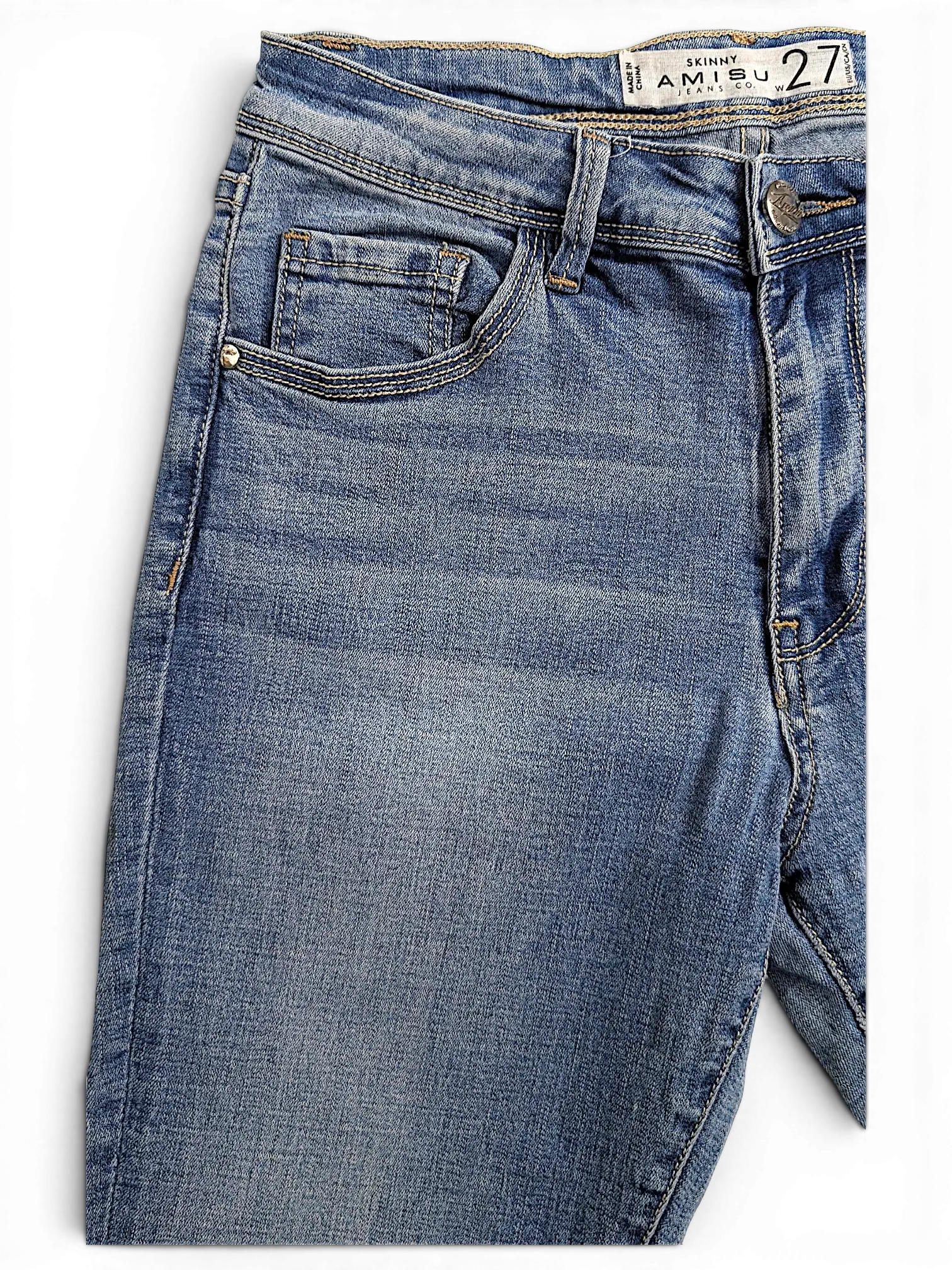 JAKE & IPI Amisu skinny blue denim jeans with a faded wash, featuring a classic five-pocket design and button fly.