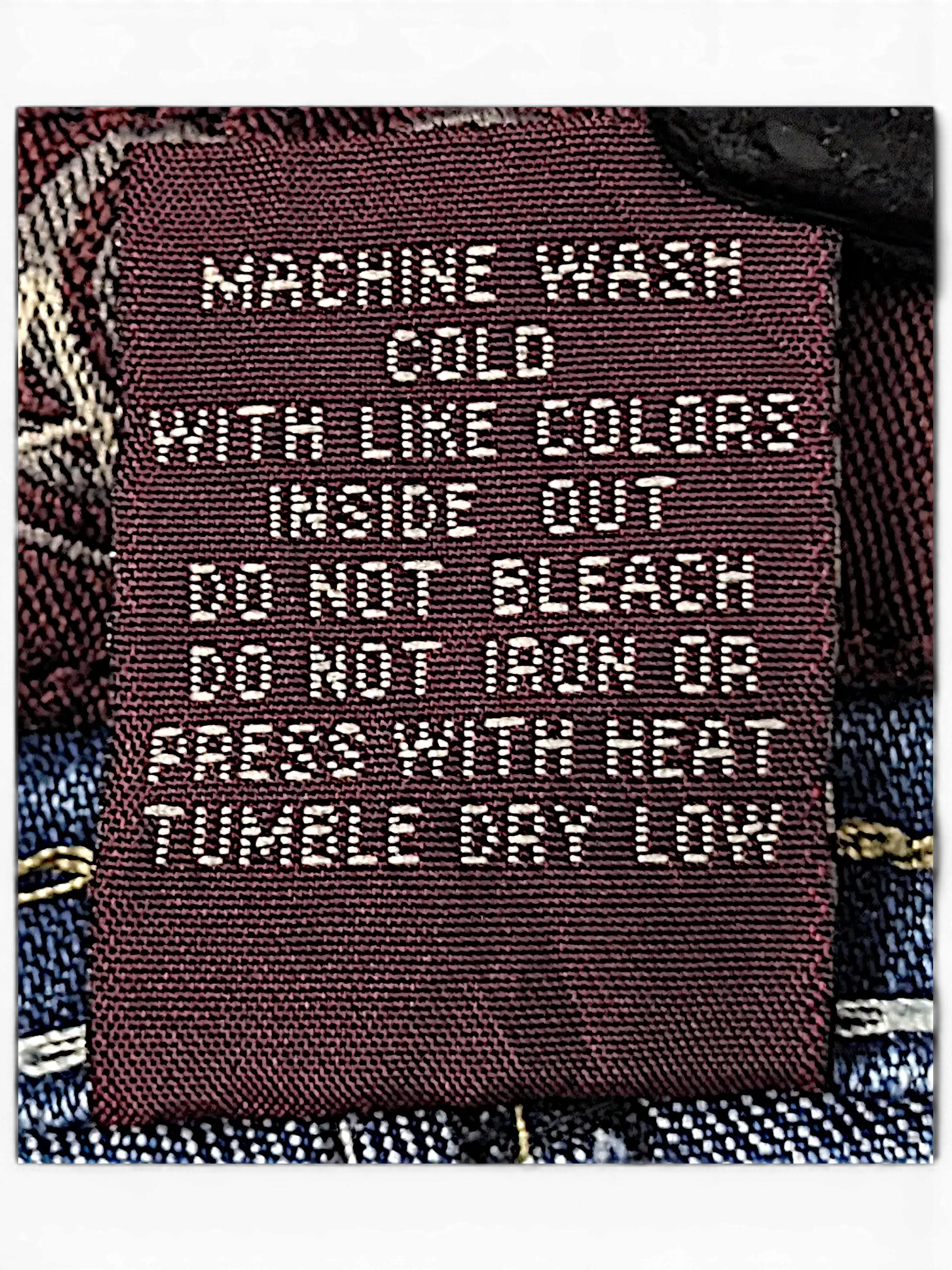 JAKE & IPI Angels Y2K jeans featuring a brown interior care label with white text and contrast stitching