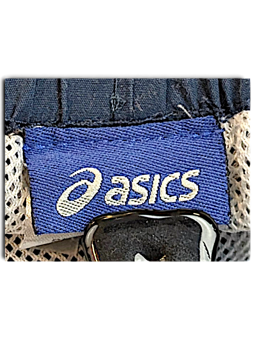 JAKE & IPI ASICS brand label on light blue track pants with white mesh lining