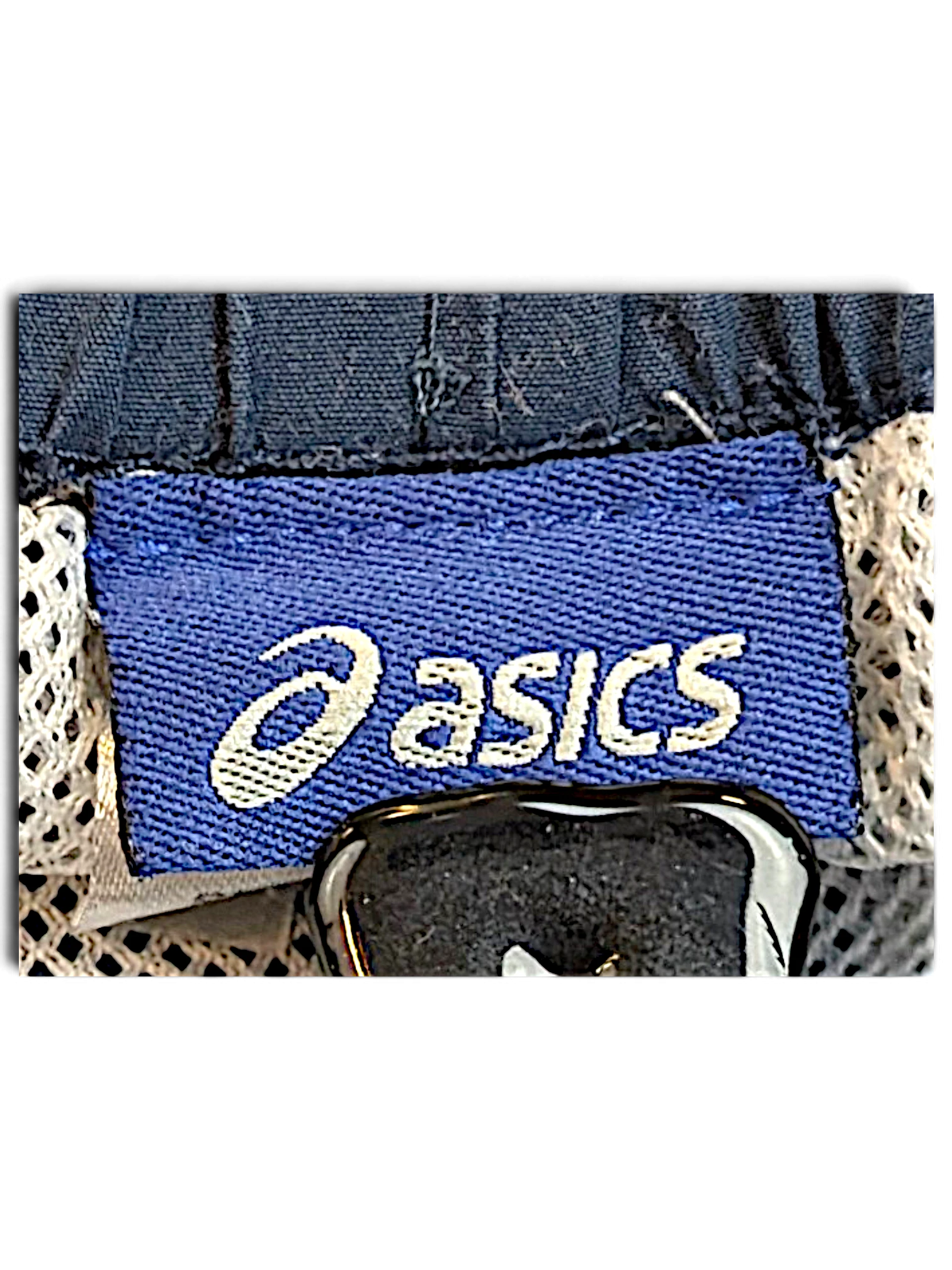JAKE & IPI ASICS brand label on light blue track pants with white mesh lining