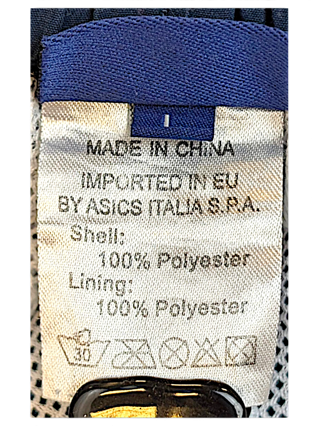JAKE & IPI ASICS track pants size L label showing 100 percent polyester composition and care instructions