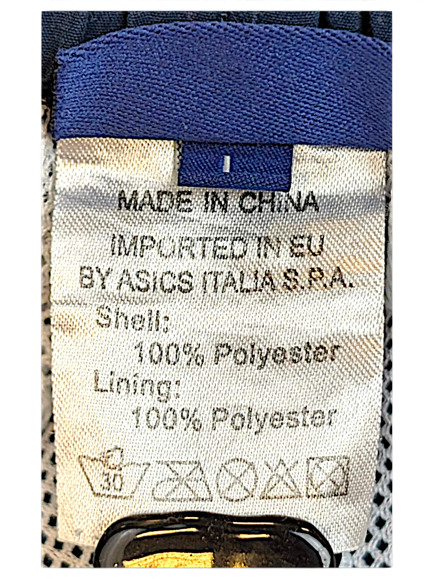 JAKE & IPI ASICS track pants size L label showing 100 percent polyester composition and care instructions