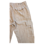 JAKE & IPI beige corduroy cargo pants with button flap pockets and adjustable waist tabs.