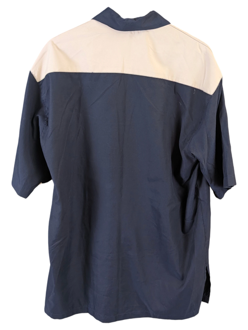 JAKE & IPI beige and navy blue short-sleeve button-up shirt with a color-blocked back view on a hanger.