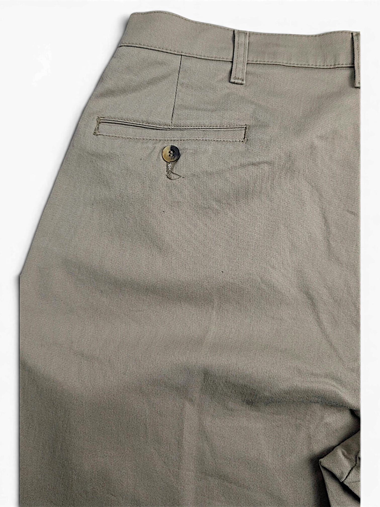 JAKE & IPI vintage beige cotton-blend pleated trousers featuring a single buttoned back pocket detail.
