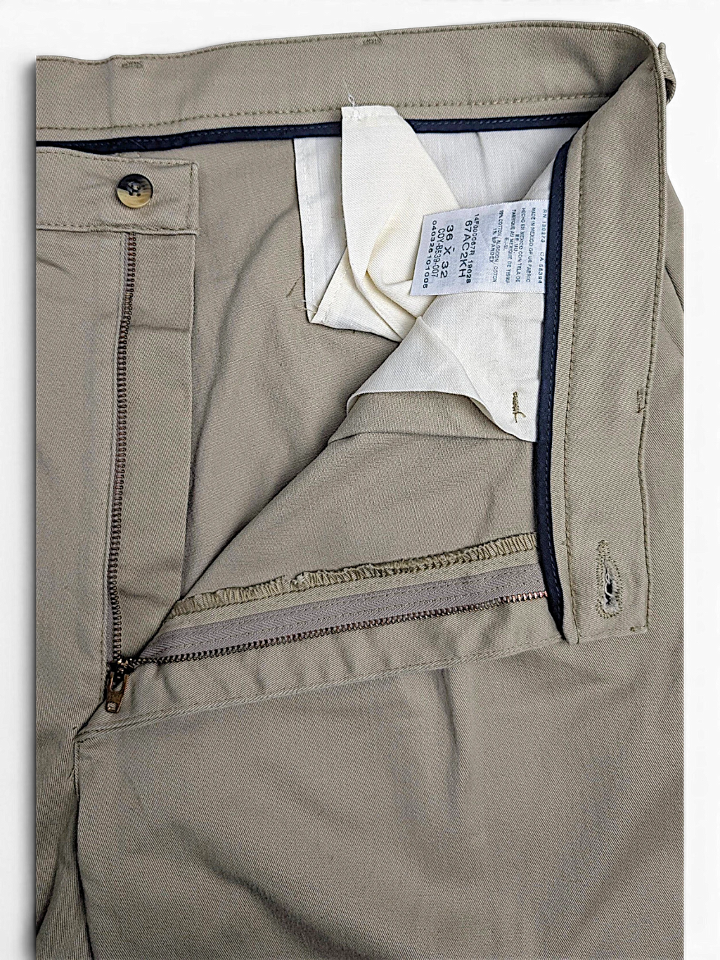 JAKE & IPI vintage beige stretch-cotton pleated trousers with zipper fly and interior care label detail