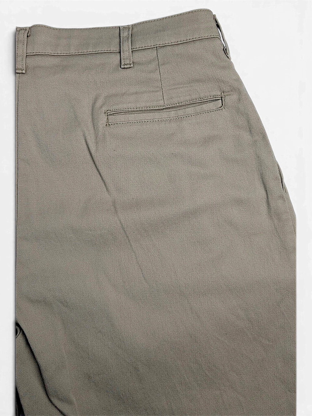 JAKE & IPI beige stretch-cotton pleated trousers featuring a rear welt pocket detail.