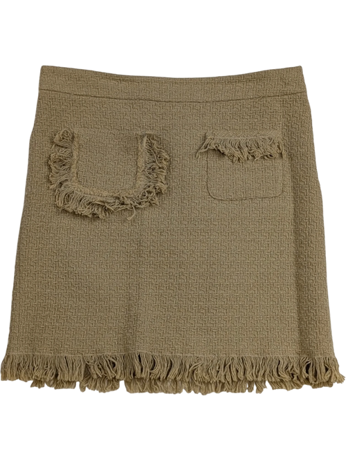 JAKE & IPI beige tweed mini skirt with fringe detailing on pockets and hem. Textured fabric, concealed zip closure.