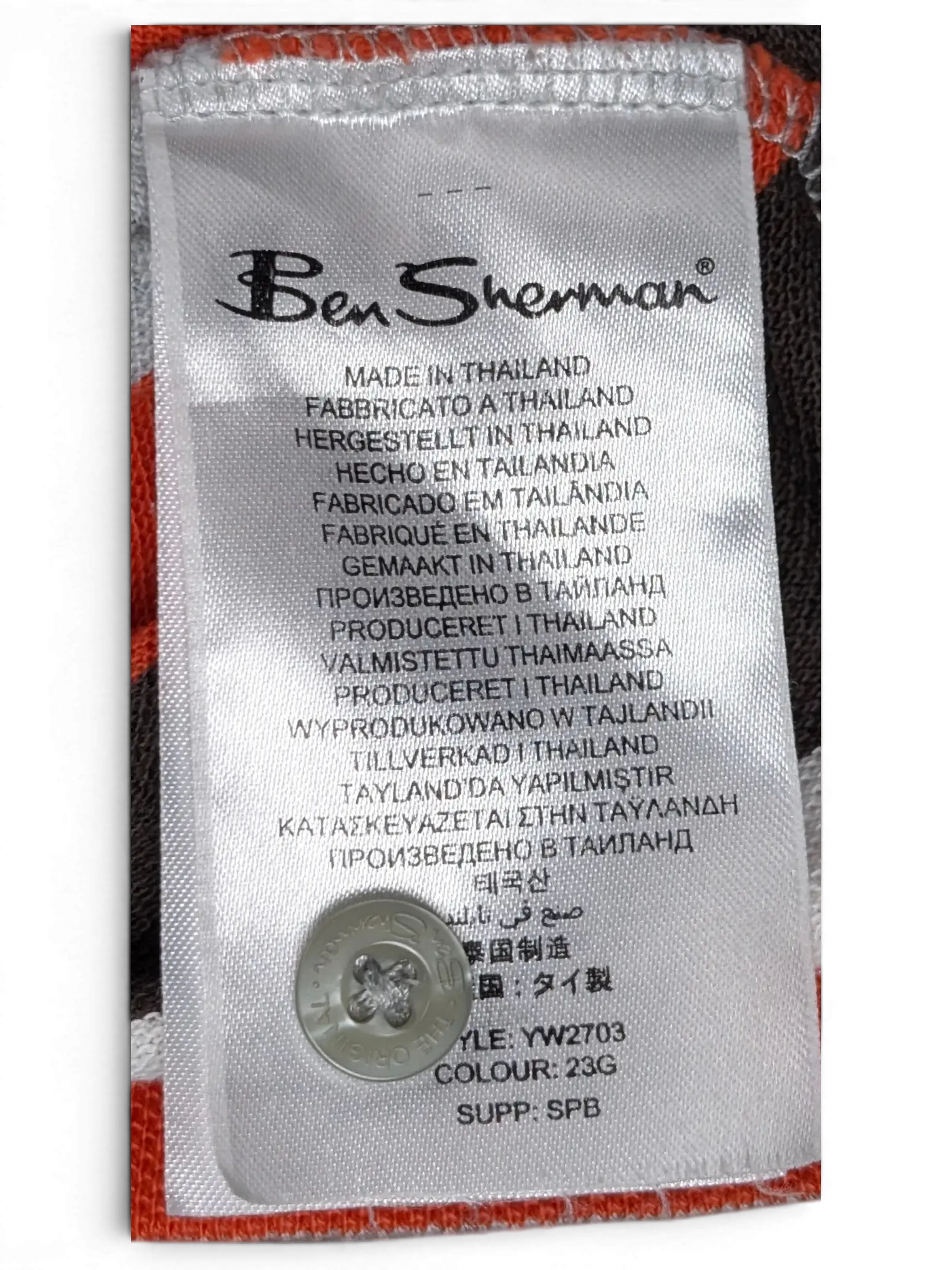 JAKE & IPI Ben Sherman striped polo shirt care label with spare button and fabric detail in grey, red, and white.